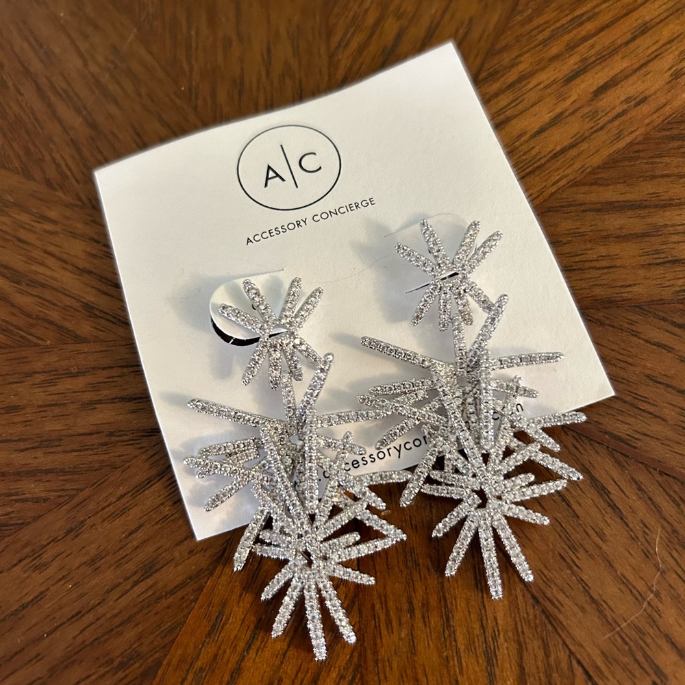 Rhinestones & silver tone starburst earrings
